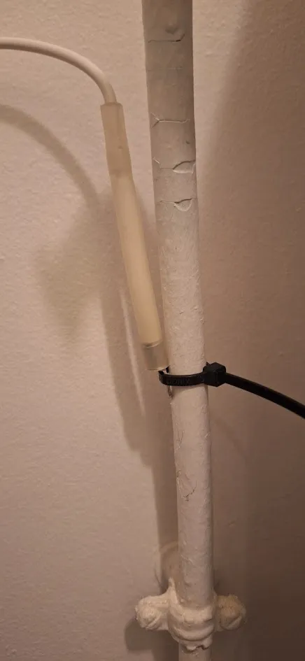 Capteur double sonde installé sur une canalisation